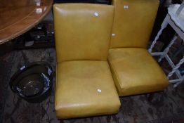 A pair of vintage mustard vinyl nursing or waiting chairs