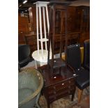 An early 20th mahogany music cabinet having fall fronts on slender legs, w 53cm