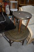 A 20th century brass top Eastern on wood base, and a similar table