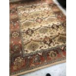 A modern polypropylene carpet square, by Next having cream and brown floral decoration, 198 x 275cm