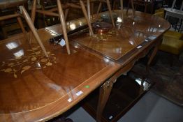 A reproduction Louis XV style dining table