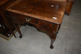 A 19th Century lowboy of typical form, handle missing to one drawer, width approx.76cm