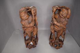 A pair of Japanese wood carved figures of fishermen 30cm tall approx