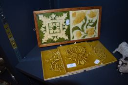 A selection of antique tiles including floral design