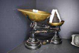 A set of cast and brass kitchen scales with weight set