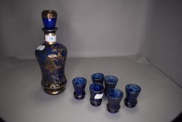 A Venitian blue glass decanter set having silver decoration