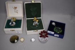 A selection of Swarovski crystal glass decorations including flowers and angel