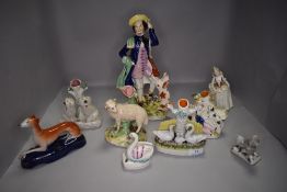 A selection of Staffordshire flatback figures and pottery including ink wells, spill vase and