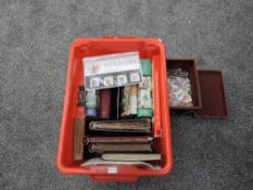 A box containing World Stamp in five albums and loose along with Stanley Gibbons catalogues