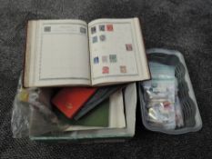 A small collection of World Stamps, mainly used, in albums and packets