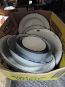 A collection of vintage enamel bowls and plates.
