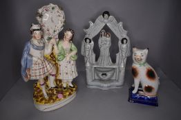 Three Staffordshire flat back figures including tin glaze Virgin Mary and child on pulpit