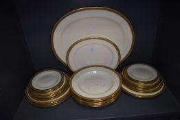 A set of cream and gold glaze dinner and dessert plates by Cauldon