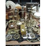 A mixed lot of brass including candle sticks,horse brasses, crumb tray and more.