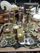 A mixed lot of brass including candle sticks,horse brasses, crumb tray and more.