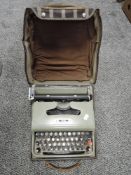 A vintage Olivetti portable type writer.