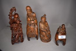 Four box wood carved Japanese figures including immortal and mythical figures