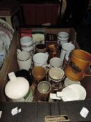 A box of vintage mugs and steins/tankards.