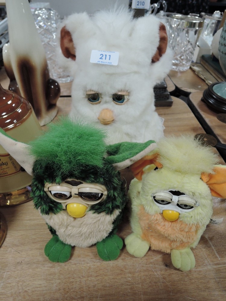 Three retro Furbys.