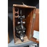 A scientific microscope in fitted case by Kima