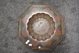 An antique brass Indian tray having scalloped centre with colour lacquer work in an Islamic design