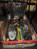 A box of vintage car or bike speedometers, gauges, tail lights and more.