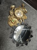 A vintage mirror having concave glass and a gilt effect composite wall clock having classic styled