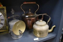 A Crestella carbide lamp and a copper kettle with similar brass example