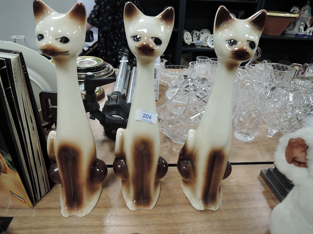 Three mid century cat figures.