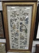 A framed Chinese silk screen needle work embroidery of a fantasy landscape in gilt frame possibly
