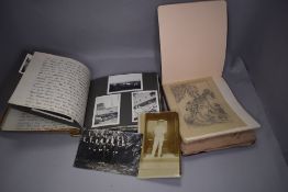 A black and white photograph album of travel interest and an autograph book