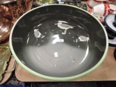 A Royal Doulton wash bowl having green and grey ground and seagull pattern.