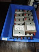A box of vintage Wier volt and amp panel meters.