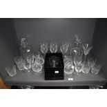 A selection of clear cut crystal glass wares including whisky and brandy glasses