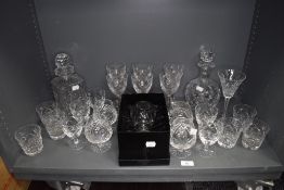 A selection of clear cut crystal glass wares including whisky and brandy glasses