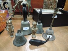 A selection of metal bells and figurines.