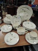 An assortment of Royal Doulton 'the Coppice' including cups and saucers,plates,coffee pot, bowls and