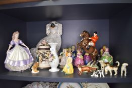 A selection of figures and figurines including Goss and Beswick