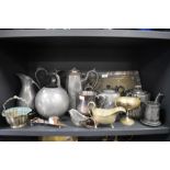 A selection of pewter and metal wares including teapots and tray