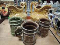Three Holkham pottery mugs and two similar jugs.