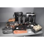 A selection of cameras and binocular sets including Hoya