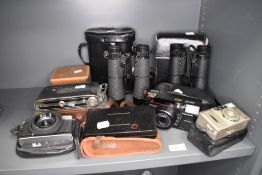 A selection of cameras and binocular sets including Hoya