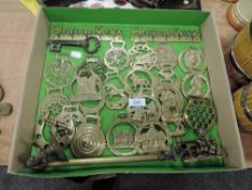 An assortment of horse brasses,key racks and a letter rack.