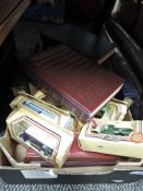 A mixed lot of readers digest novels and boxed Lledo car collectables.