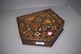 An elaborate straw work box with veneer decoration and mother of pearl inlay