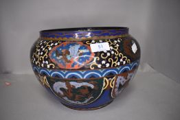 A large Japanese cloisonne fish bowl or planter having blue and green ground with phoenix and dragon