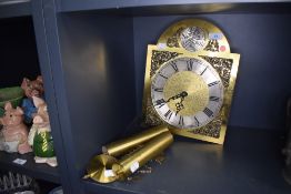 A brass clock face and weight set by Tempus Fugit