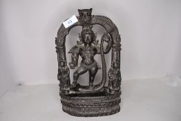 An antique detailed and carved wooden figure or totem of Indian god Kalinga Narthanam