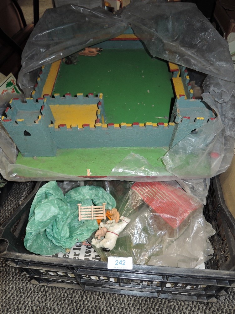 A vintage model fort and farm yard toys.