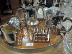 A collection of plated ware with tray including tea pot, hot water pot, jug and more.